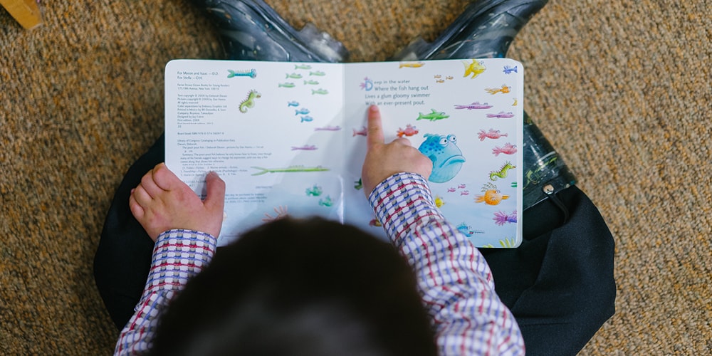 Frontline Christian Pre-School - Boy reading Frontline Christian Pre-School - Boy reading